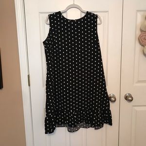 Woman’s black dress with with polka dots